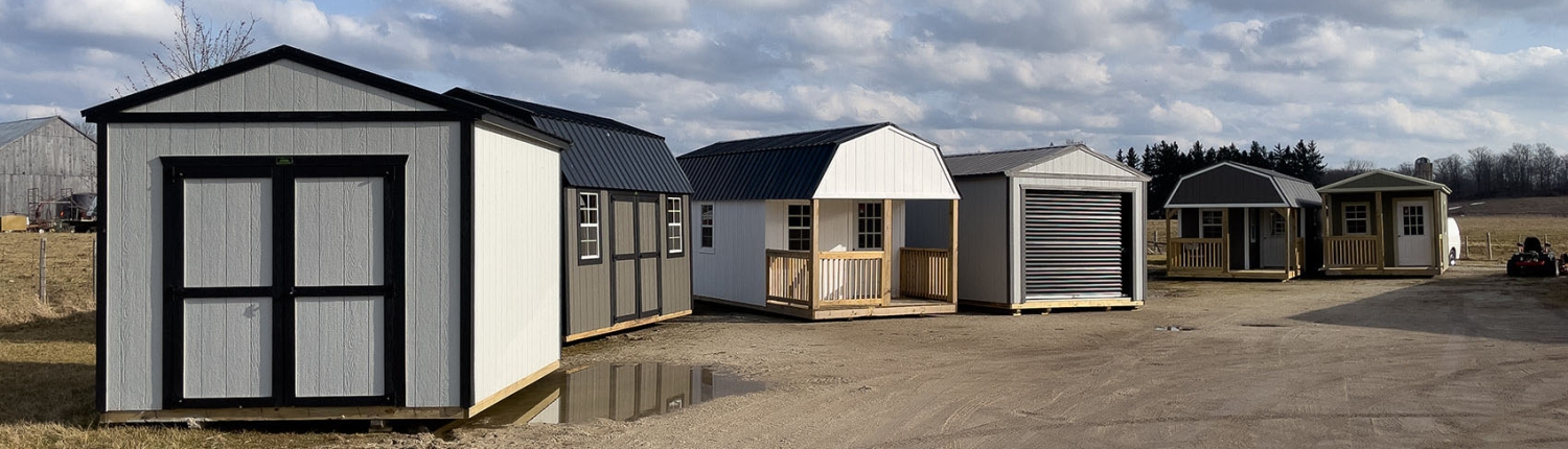 Sheds, Garages, Cabins, Tiny Homes and Bunkies for sale on the dealership lot of Multiply Portable Buildings.